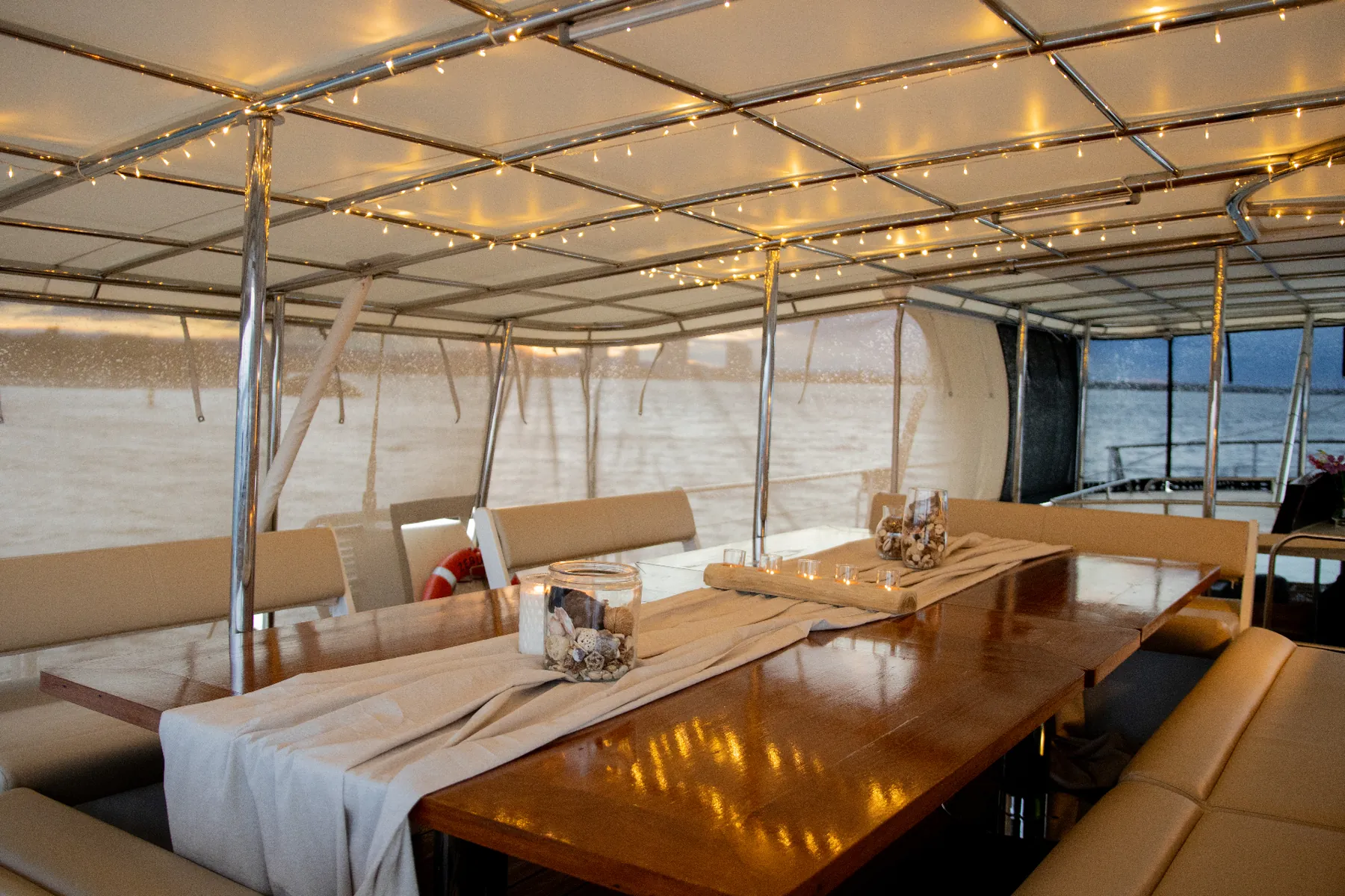 The Captain's Table set for a celebration aboard Gold Coast sailing superyacht VOYŌ