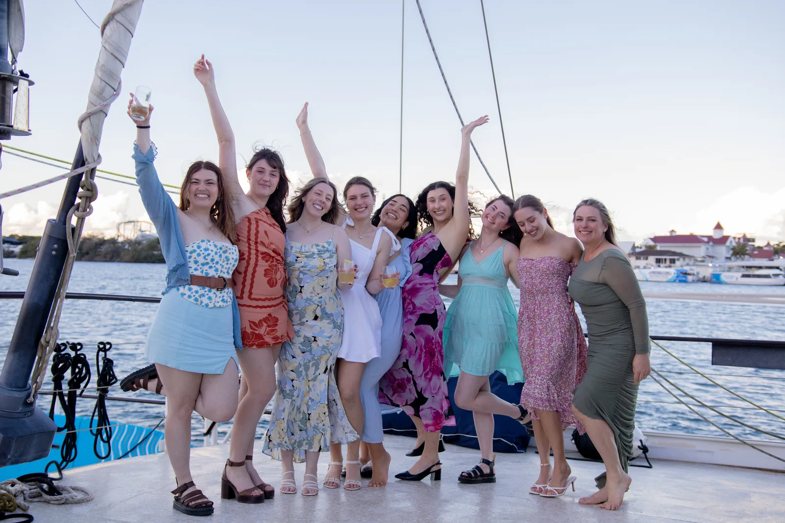 A hens group celebrating on deck aboard VOYŌ on the Broadwater