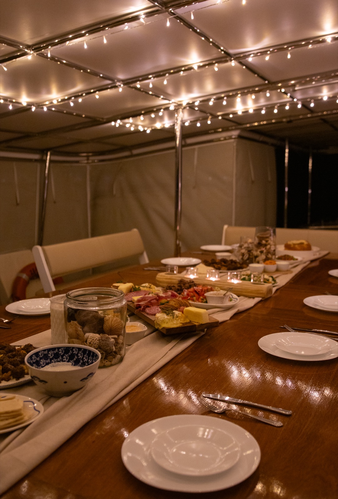 Captain's Banquet Table set with grazing platters aboard VOYŌ