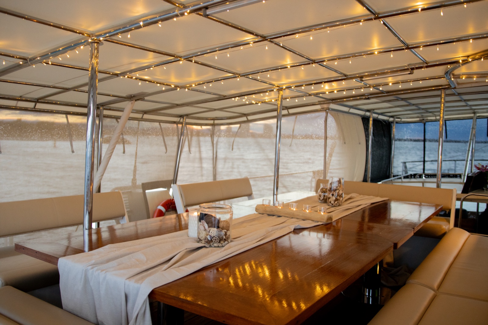 Elegant high-tea styled table aboard VOYŌ sailing superyacht