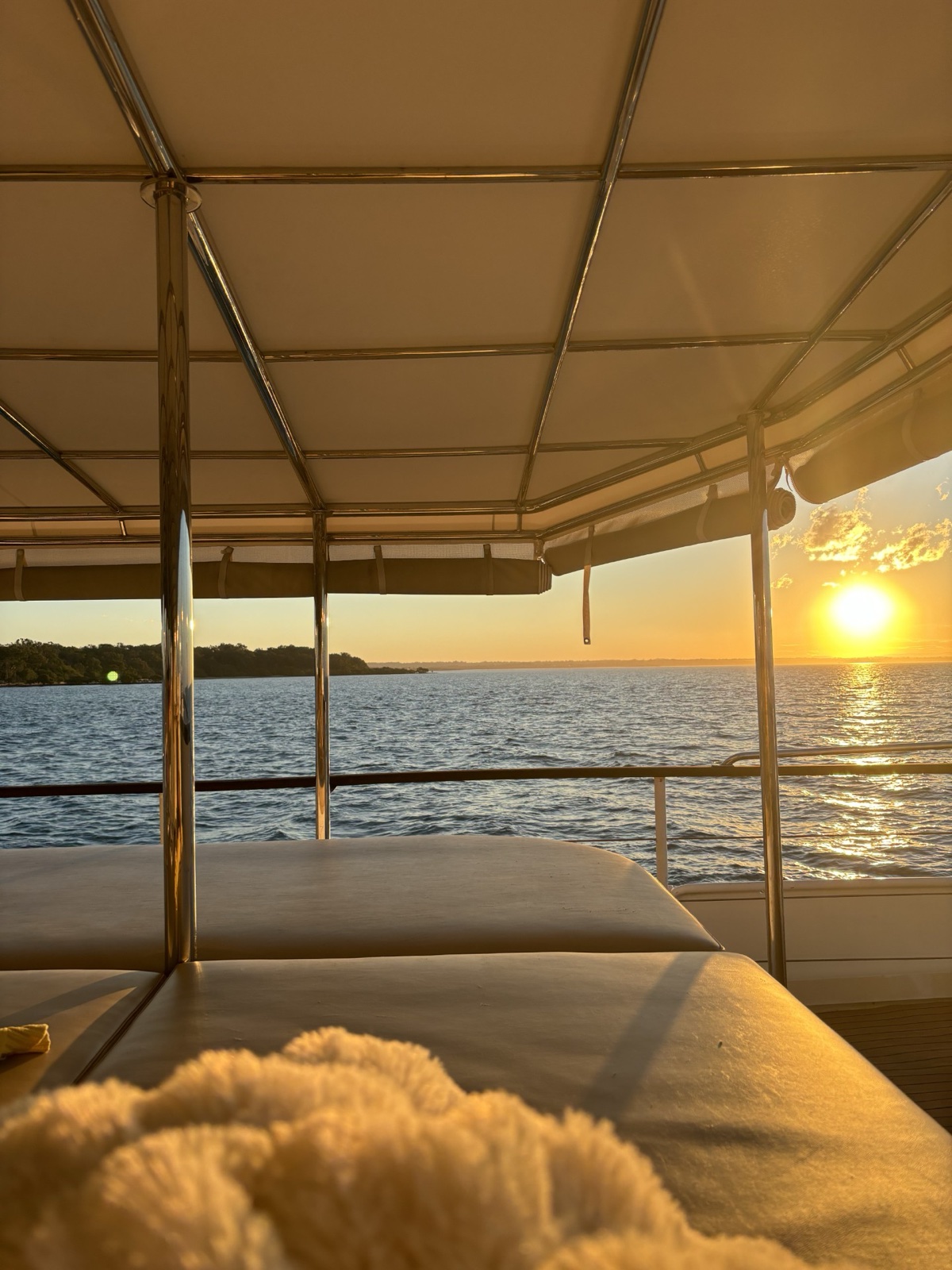 Guests enjoying a sunset sail aboard VOYŌ on the Gold Coast Broadwater